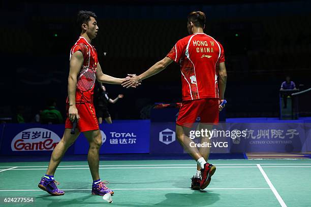 Chai Biao of China and Hong Wei of China celebrate a point against M Kolding of Denmark and M Conrad-petersen of Denmark during men's doubles...