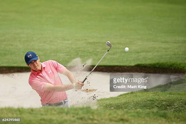 Jordan Spieth of the United States plays out of the bunker on the 1st hole during day three of the Australian Open at Royal Sydney Golf Club on...