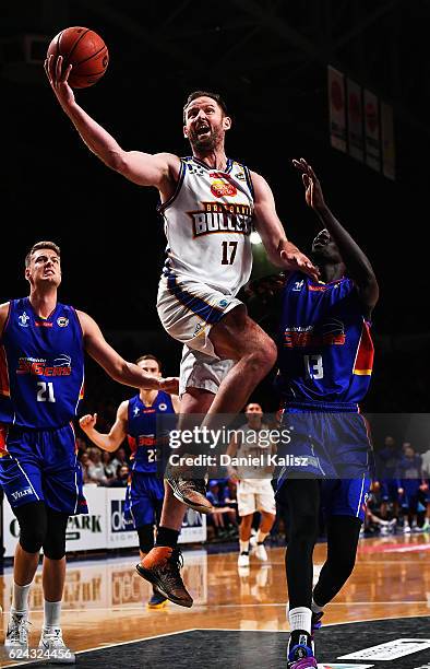 Anthony Petrie of the Brisbane Bullets makes a shot on basket over Majok Deng of the Adelaide 36ers during the round seven NBL match between the...