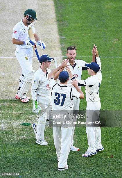 Jackson Coleman of Victoria celebrates the wicket of Stephen Cook of South Africa during the One Day International tour match between Victoria and...