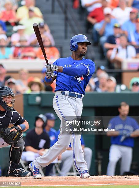 Domonic Brown of the Toronto Blue Jays bats during the spring training game against the Detroit Tigers at Joker Marchant Stadium on March 29, 2016 in...