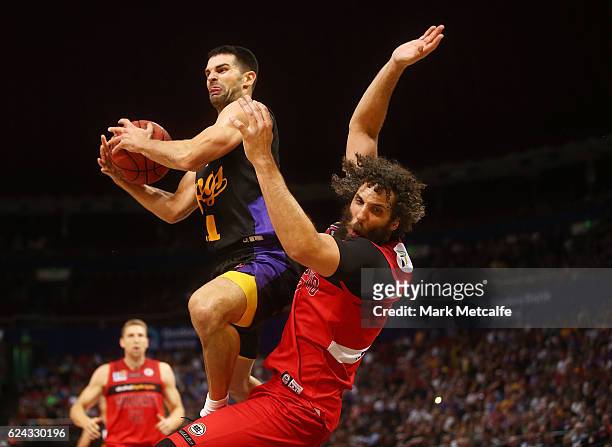 Kevin Lisch of the Kings drives to the basket and is challenged by Matt Knight of the Wildcats during the round seven NBL match between the Sydney...
