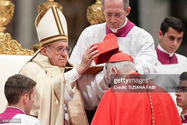 Archbishop of Tlanepantla in Mexico Carlos Aguiar Retes kneels before Pope Francis to pledge allegiance and become cardinal, on November 19, 2016...