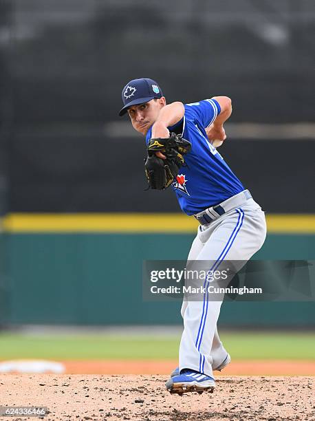 Ambidextrous switch pitcher Pat Venditte of the Toronto Blue Jays pitches during the spring training game against the Detroit Tigers at Joker...