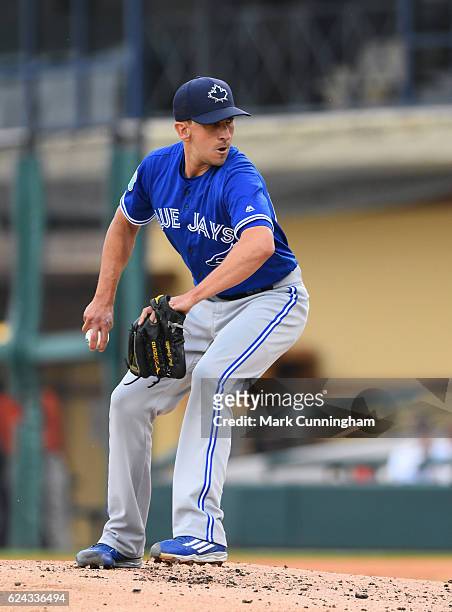Ambidextrous switch pitcher Pat Venditte of the Toronto Blue Jays pitches during the spring training game against the Detroit Tigers at Joker...