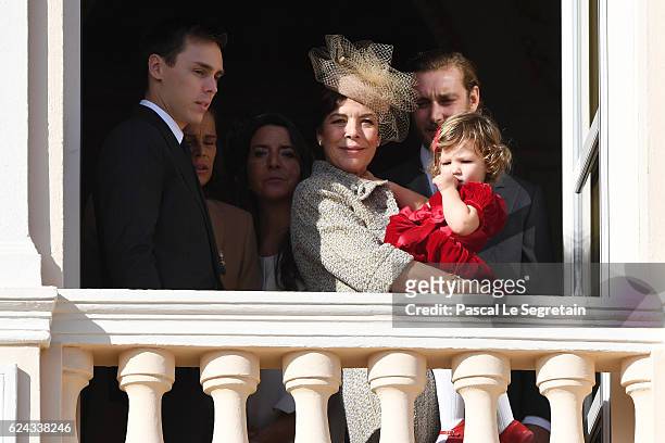 Louis Ducruet, Princess Caroline of Hanover and India Casiraghi greet the crowd from the palace's balcony during the Monaco National Day Celebrations...