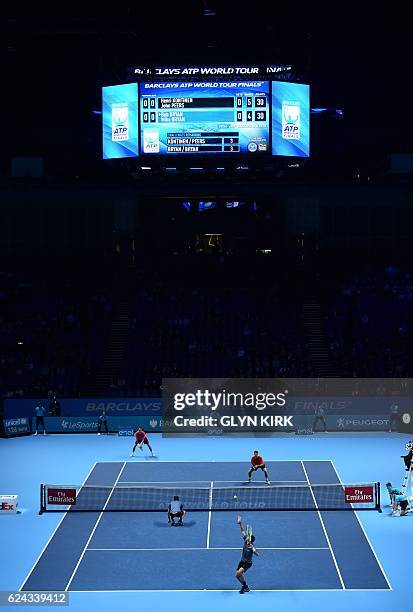 Finland's Henri Kontinen and his partner Australia's John Peers play against US player Bob Bryan and US player Mike Bryan during their men's...