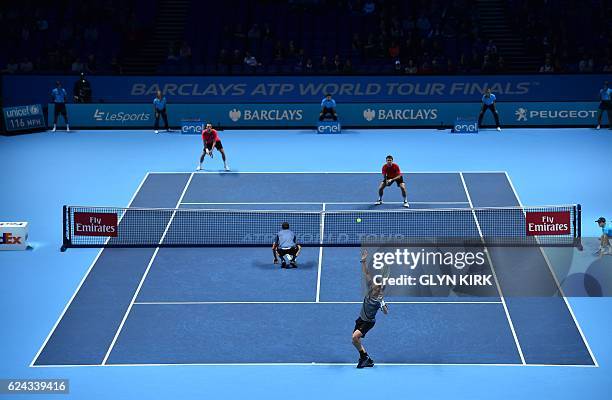 Finland's Henri Kontinen and his partner Australia's John Peers play against US player Bob Bryan and US player Mike Bryan during their men's...