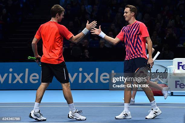 Finland's Henri Kontinen and his partner Australia's John Peers celebrate beating US player Bob Bryan and US player Mike Bryan during their men's...