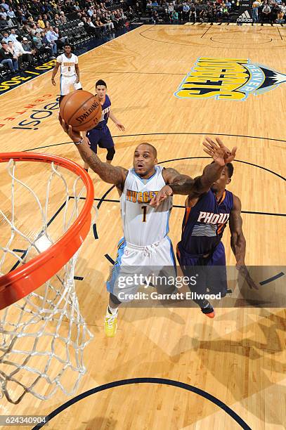 Jameer Nelson of the Denver Nuggets drives to the basket against the Phoenix Suns on November 16, 2016 at the Pepsi Center in Denver, Colorado. NOTE...