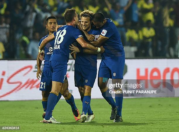 Mumbai City FC captain Diego Forlan celebrates with teammates after scoring a goal during the Indian Super League football match between Kerala...