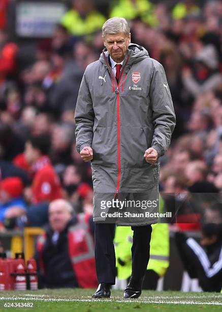 Arsene Wenger, Manager of Arsenal celebrates during the Premier League match between Manchester United and Arsenal at Old Trafford on November 19,...