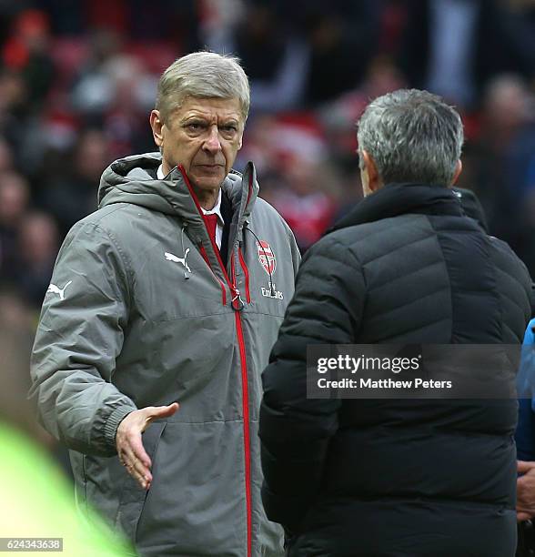 Manager Jose Mourinho of Manchester United and Manager Arsene Wenger of Arsenal shake hands after the Premier League match between Manchester United...