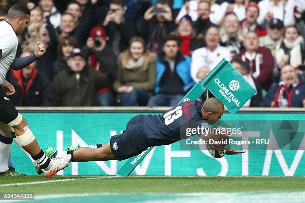 Jonathan Joseph of England dives to score his team's first try during the Old Mutual Wealth series match between England and Fiji at Twickenham...