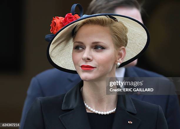 Princess Charlene attends the celebrations marking Monaco's National Day at the Monaco Palace on November 19, 2016. / AFP / POOL / ERIC GAILLARD