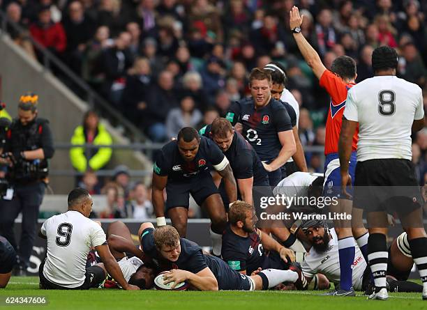 Joe Launchbury of England scores his team's fifth try during the Old Mutual Wealth series match between England and Fiji at Twickenham Stadium on...