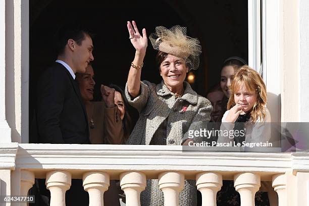 Louis Ducruet, Princess Stephanie of Monaco and Princess Caroline of Hanover greet the crowd from the palace's balcony during the Monaco National Day...