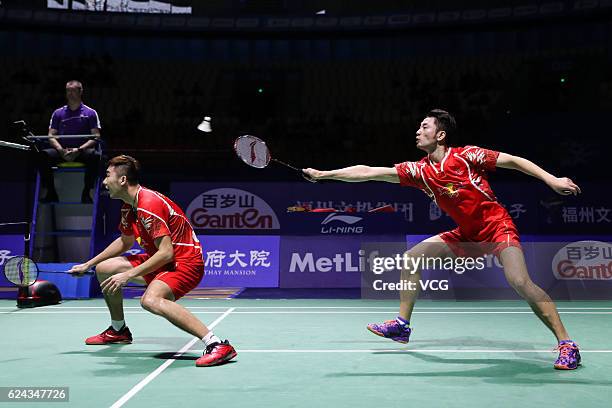 Chai Biao of China and Hong Wei of China compete against M Gideon of India and K Sukamuljo of India during men's doubles semifinal match on day five...