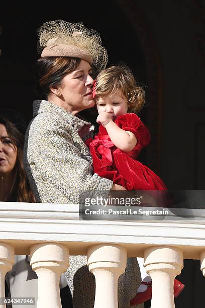 Princess Caroline of Hanover and India Casiraghi greet the crowd from the palace's balcony during the Monaco National Day Celebrations on November...