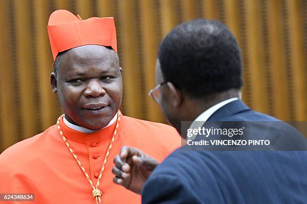 Newly elevated cardinal, Archbishop of Bangui, Dieudonne Nzapalainga, speaks with relatives during a courtesy visit following a consistory on...