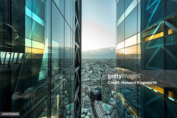 aerial of city with glass building - office architecture stock pictures, royalty-free photos & images