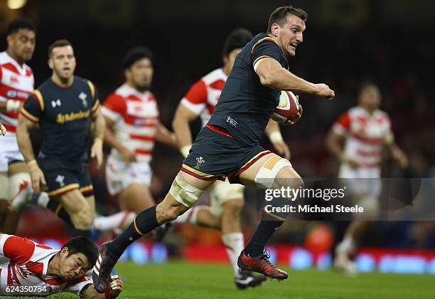Sam Warburton of Wales bursts through to score a try during the International match between Wales and Japan at the Principality Stadium on November...