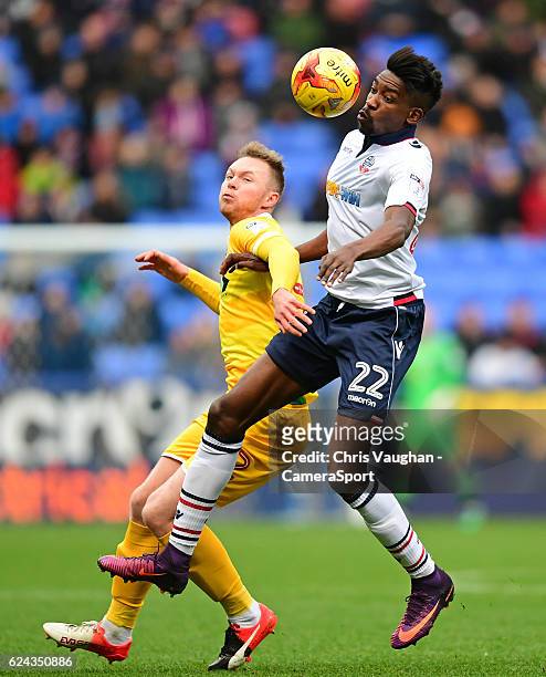 Bolton Wanderers' Sammy Ameobi vies for possession with Millwall's Aiden O'Brien during the Sky Bet League One match between Bolton Wanderers and...