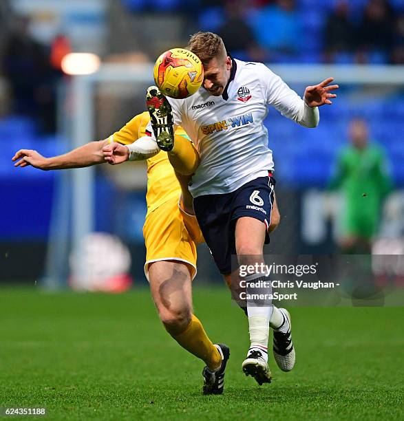 Bolton Wanderers' Josh Vela vies for possession with Millwall's Tony Craig during the Sky Bet League One match between Bolton Wanderers and Millwall...