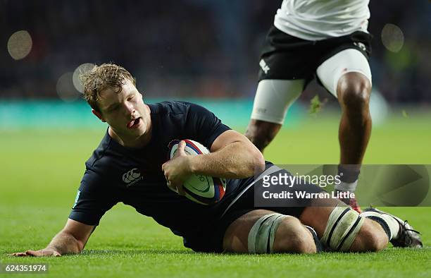 Joe Launchbury of England dives to score his team's ninth try during the Old Mutual Wealth series match between England and Fiji at Twickenham...