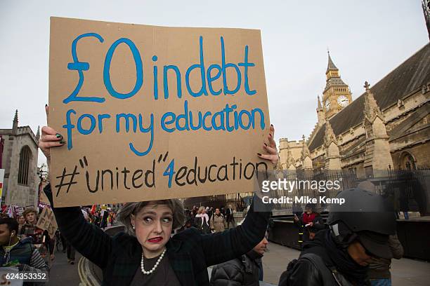 Protester dressed up as Prime Minister Theresa May holds up a sign National Union of Students and the University and College Union demonstration...