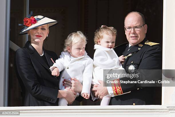 Princess Charlene of Monaco and Prince Albert II of Monaco greet the crowd from the palace's balcony with their children Prince Jacques of Monaco and...