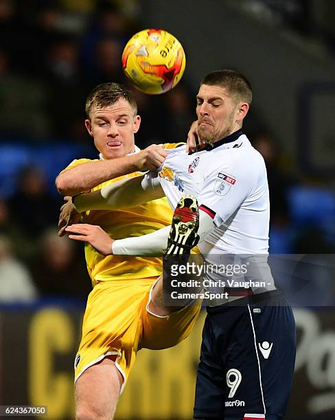 Bolton Wanderers' Jamie Proctor vies for possession with Millwall's Tony Craig during the Sky Bet League One match between Bolton Wanderers and...