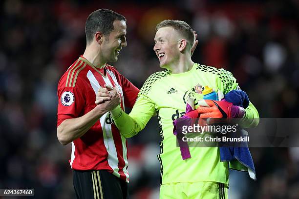 John O'Shea of Sunderland congratulates team-mate Jordan Pickford at full-time following the Barclays Premier League match between Sunderland and...