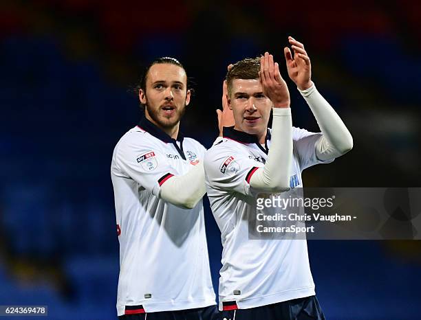 Bolton Wanderers goal-scorers Tom Thorpe, left, and Josh Vela applaud the fans at the end of the game during the Sky Bet League One match between...