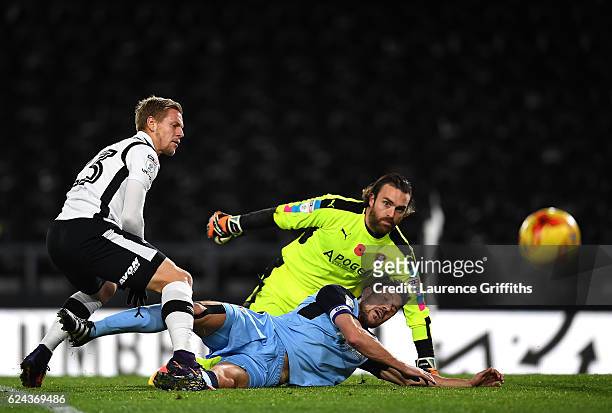 Matej Vydra of Derby County battles with Lee Camp and Richard Wood of Rotherham United during the Sky Bet Championship match between Derby County and...