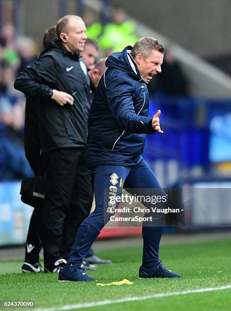 Millwall manager Neil Harris shouts instructions to his team from the dug-out during the Sky Bet League One match between Bolton Wanderers and...