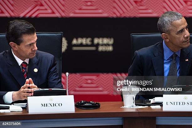 Mexico's President Enrique Pena Nieto and US President Barack Obama wait for a meeting with Trans-Pacific Partnership Leaders during the Asia-Pacific...