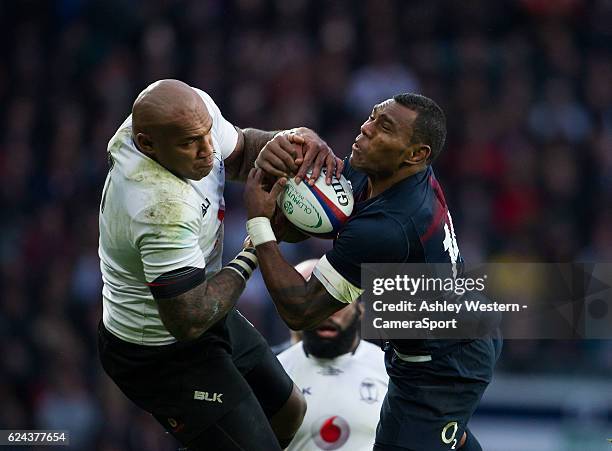 England's Semesa Rokoduguni battles for possession with Fiji's Nemani Nadolo during the Autumn International match between England v Fiji at...