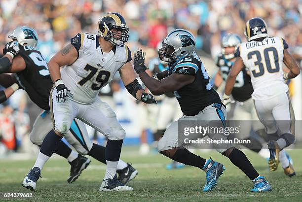 Defensive end Charles Johnson of the Carolina Panthers and offensive tackle Robert Havenstein of the Los Angeles Rams battle at the line of scrimmage...