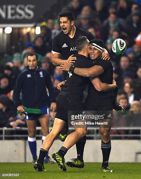 Malakai Fekitoa of New Zealand celebrates scoring a try with Israel Dagg of New Zealand and Anton Liernert-Brown of New Zealand during the...