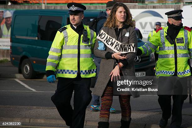 Climate activists block a road by Heathrow in protest against the proposed third runway November 19th 2016 in Heathrow, London,United Kingdom. Police...