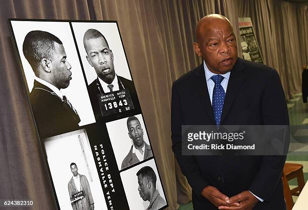 Congressman/Civil Rights Icon John Lewis poses by images and his arrest record for leading a nonviolent sit-in at Nashville's segreated lunch...