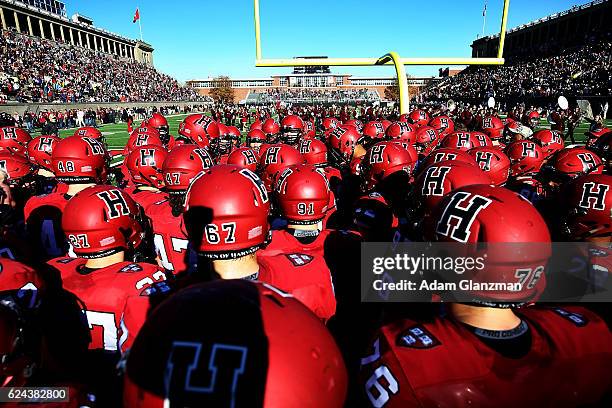 The Harvard Crimson huddle in the end zone before the game against the Yale Bulldogs at Harvard Stadium on November 19, 2016 in Boston, Massachusetts.