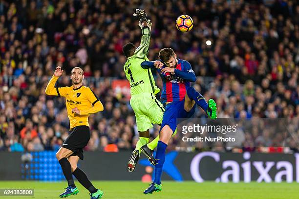 Pique and Carlos Kameni during the match between FC Barcelona vs Malaga CF, for the round 12 of the Liga Santander, played at Camp Nou Stadium on...