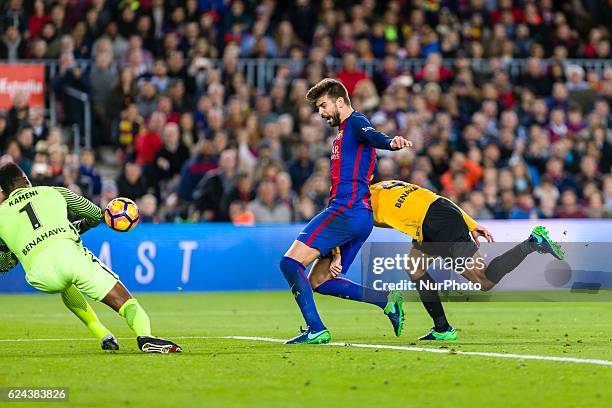 Pique and Carlos Kameni during the match between FC Barcelona vs Malaga CF, for the round 12 of the Liga Santander, played at Camp Nou Stadium on...