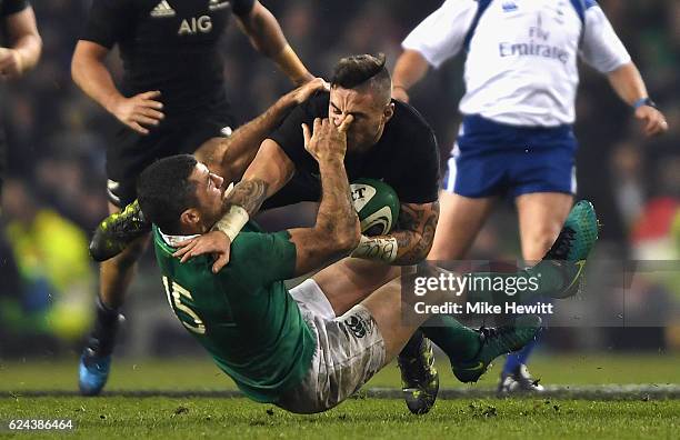 Rob Kearney of Ireland tackles TJ Perenara of New Zealand during the International match between Ireland and New Zealand All Blacks at Aviva Stadium...