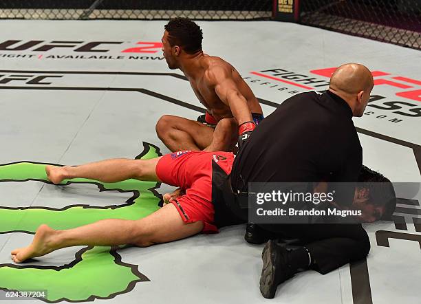 Kevin Lee celebrates his submission victory over Magomed Mustafaev of Russia in their lightweight bout during the UFC Fight Night at the SSE Arena on...