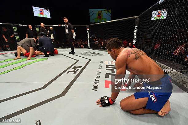 Kevin Lee celebrates his submission victory over Magomed Mustafaev of Russia in their lightweight bout during the UFC Fight Night at the SSE Arena on...