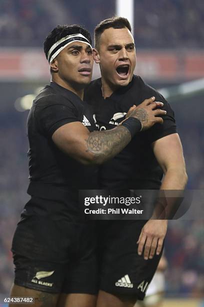 Malakai Fekitoa of New Zealand celebrates his try with Israel Dagg during the international rugby match between Ireland and the New Zealand All...