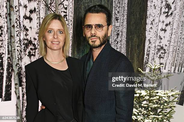 Carlo Brandelli and Charlotte Brandelli attend Claridge's Christmas Tree 2016 Party, with tree designed by Sir Jony Ive and Marc Newson, at...